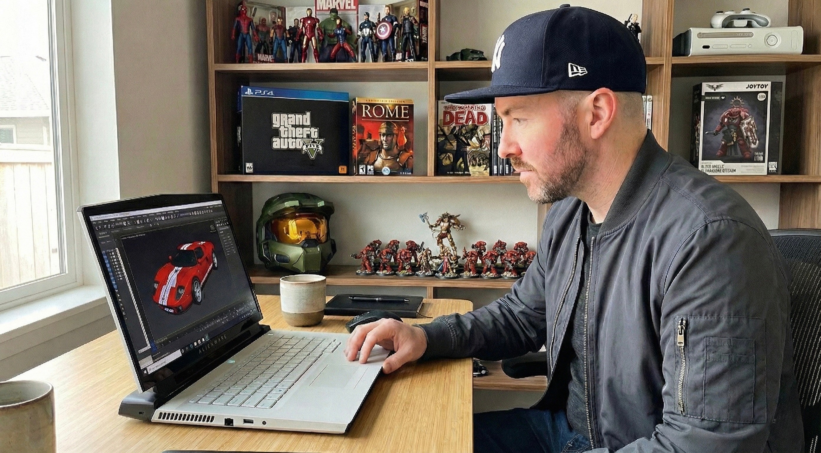 Julian Murphy working at a desk on a laptop